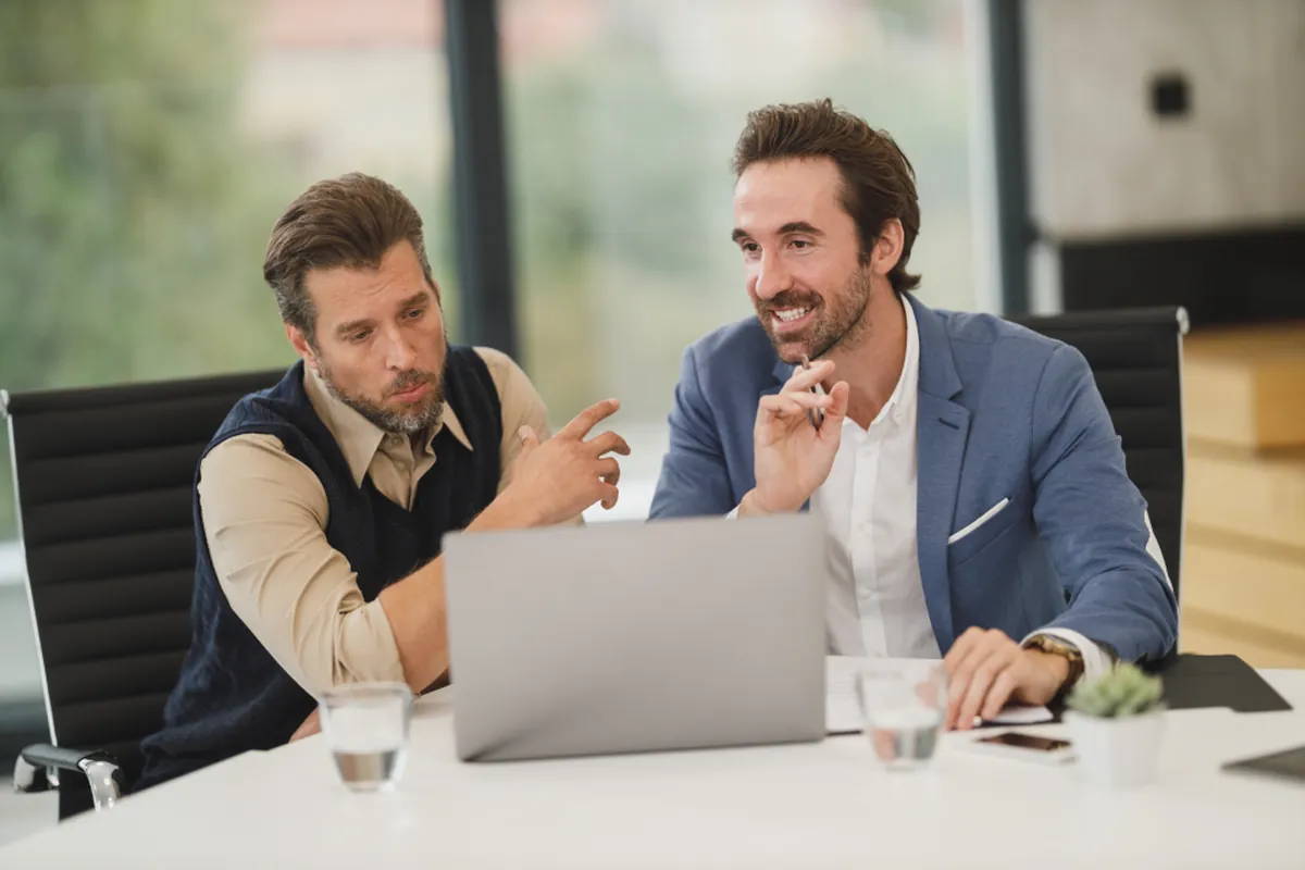 Consultants discussing a plan with a client
