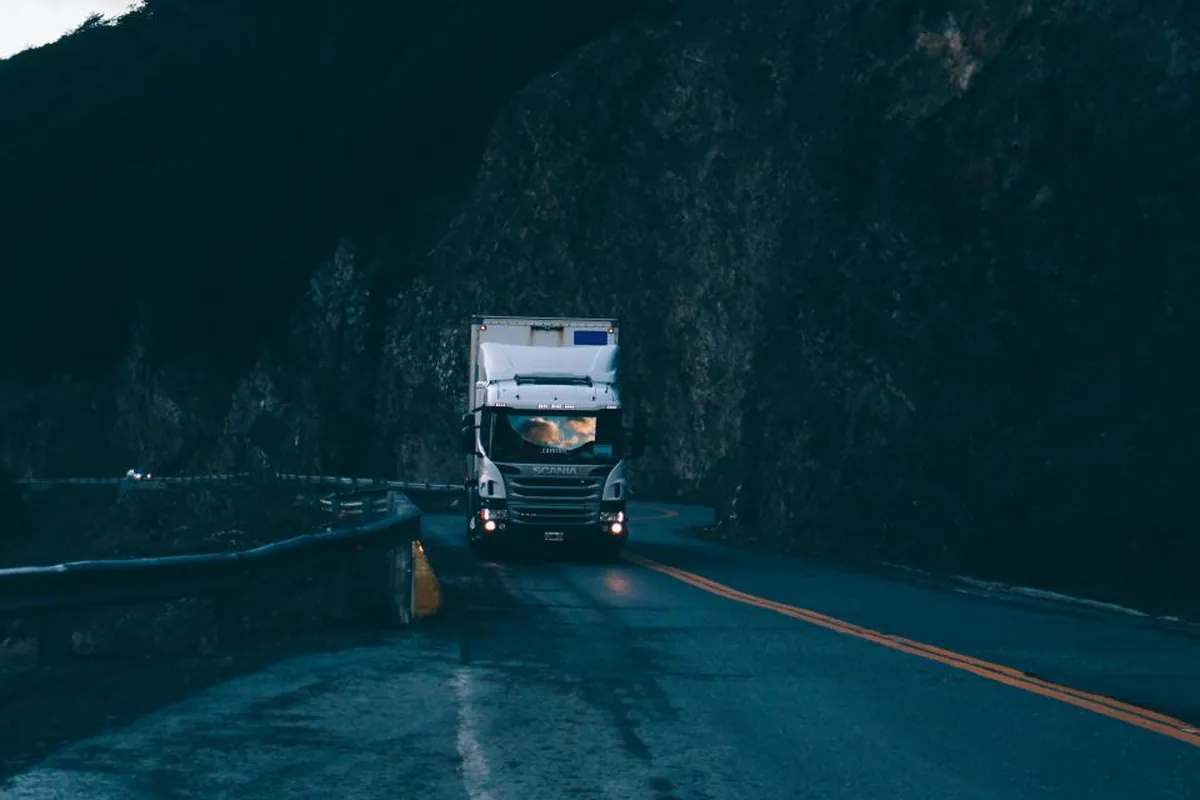 Delivery truck on the road at dusk
