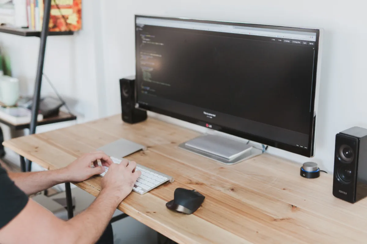 Engineer maintaining an application at a desk