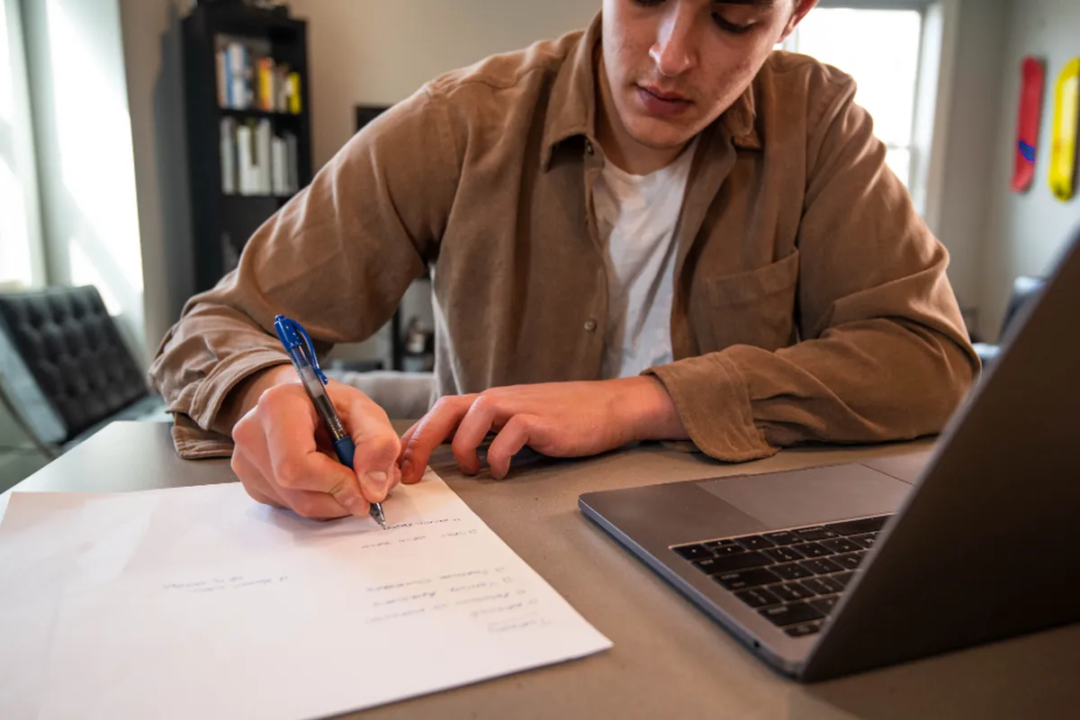 Tester reviewing results and writing notes