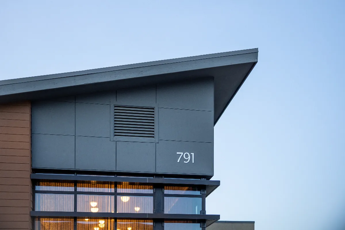Modern apartment building against a blue sky
